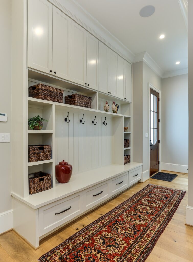 area by the front door with a coat rack and shoe storage